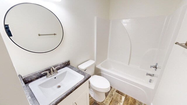 40 Beacon St, Camilla, GA 31730 - bathroom with vanity, toilet, bathtub / shower combination, and wood finished floors