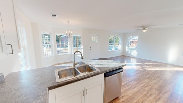 40 Beacon St, Camilla, GA 31730 - kitchen featuring dishwasher, a sink, a chandelier, white cabinets, and light wood finished floors