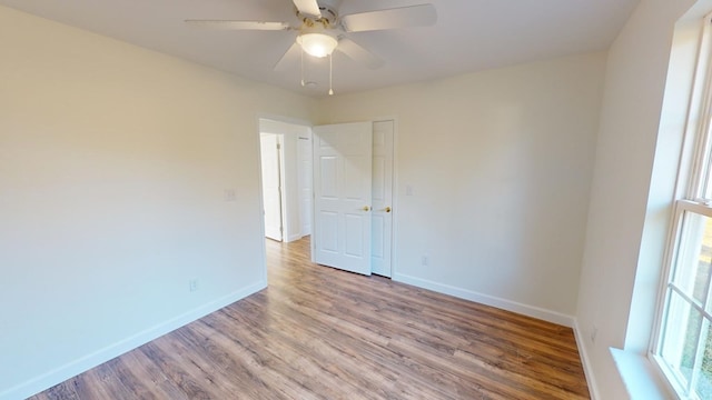40 Beacon St, Camilla, GA 31730 - unfurnished room with wood finished floors, baseboards, and ceiling fan