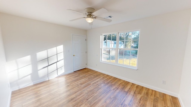 40 Beacon St, Camilla, GA 31730 - empty room with light wood-style flooring, baseboards, and a ceiling fan
