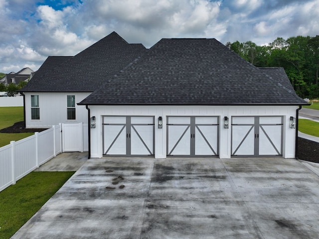 347 Madison Grv, Thomasville, GA 31757 - view of front of house with concrete driveway, a shingled roof, a garage, and fence