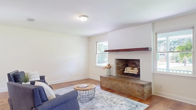 193 E Live Oak Cir, Thomasville, GA 31792 - living area featuring wood finished floors and a fireplace
