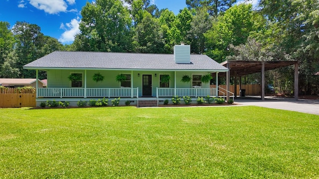 193 E Live Oak Cir, Thomasville, GA 31792 - view of front of house featuring covered porch, roof with shingles, a chimney, and driveway