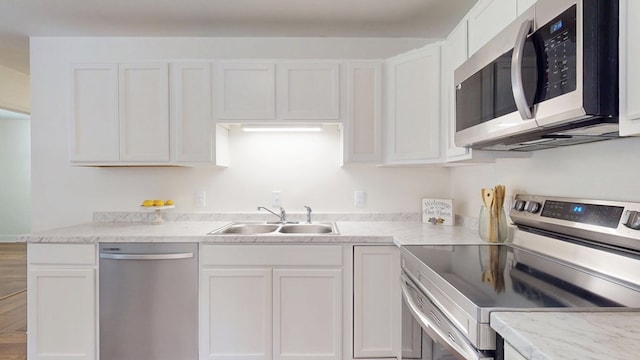 193 E Live Oak Cir, Thomasville, GA 31792 - kitchen with stainless steel appliances and white cabinetry