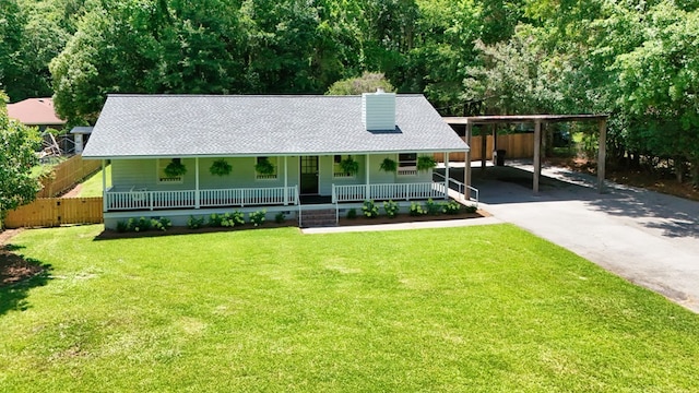 193 E Live Oak Cir, Thomasville, GA 31792 - farmhouse with a porch, a shingled roof, a carport, a chimney, and driveway