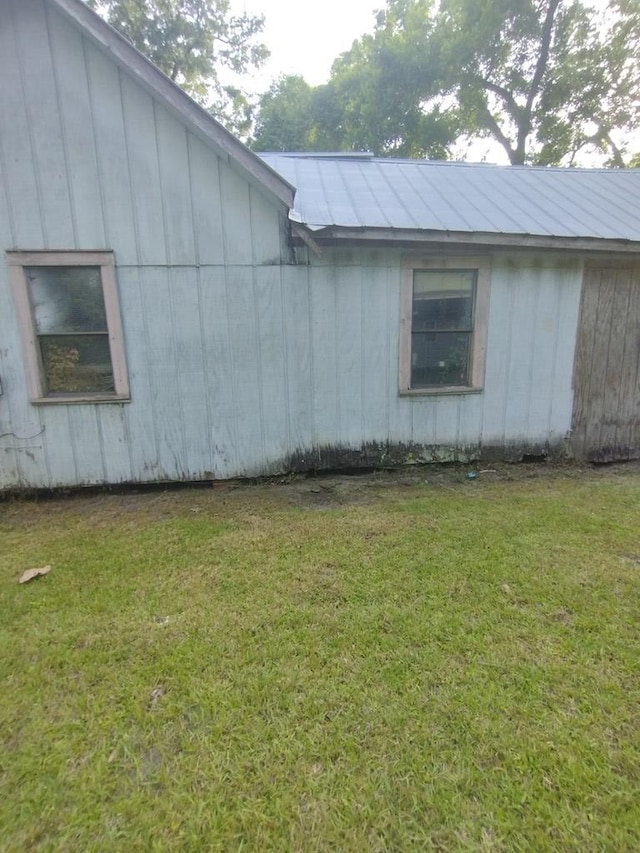 544 W Clay St, Thomasville, GA 31792 - view of property exterior featuring a yard and metal roof