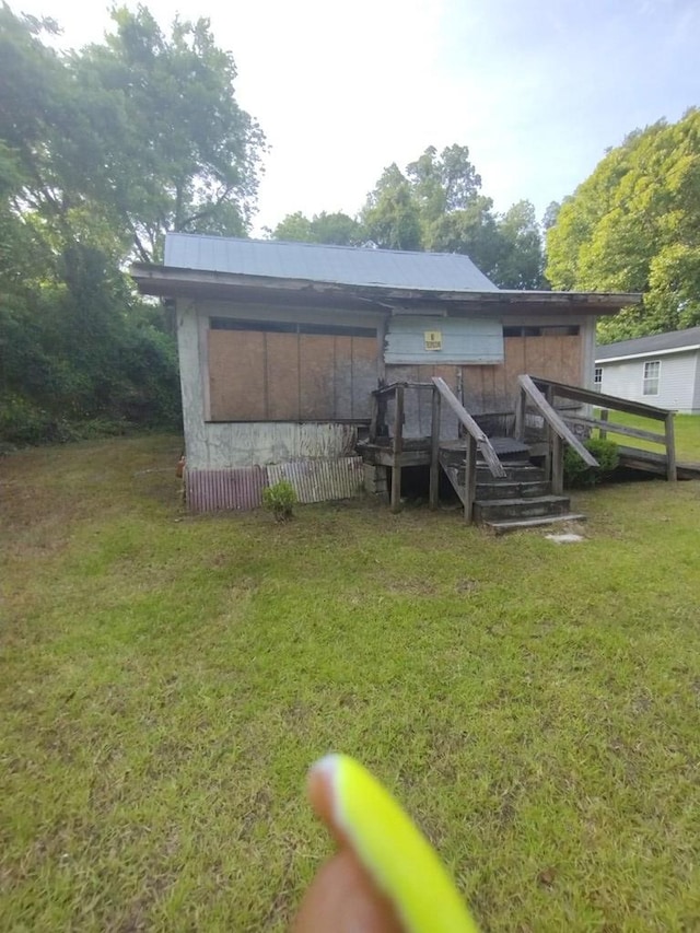 544 W Clay St, Thomasville, GA 31792 - back of house featuring a lawn and a deck