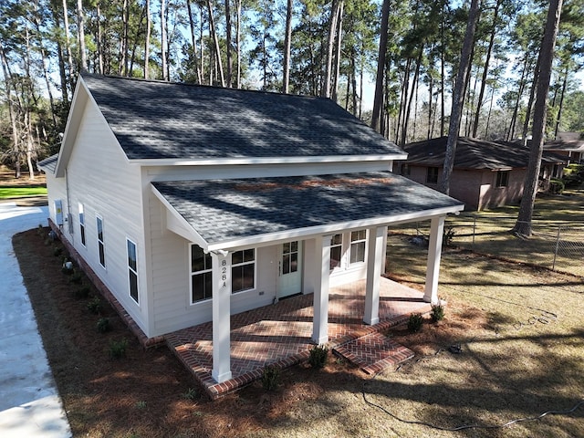 view of outbuilding featuring covered porch