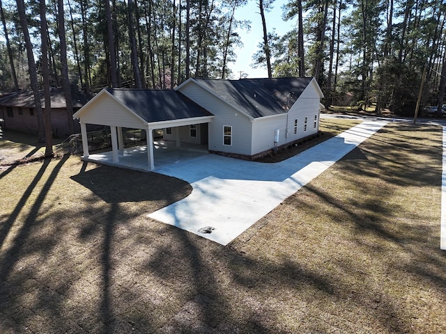 exterior space featuring driveway and a carport