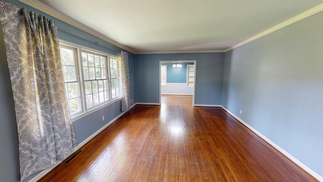 610 Partridge Dr, Thomasville, GA 31792 - empty room featuring wood finished floors, baseboards, and crown molding