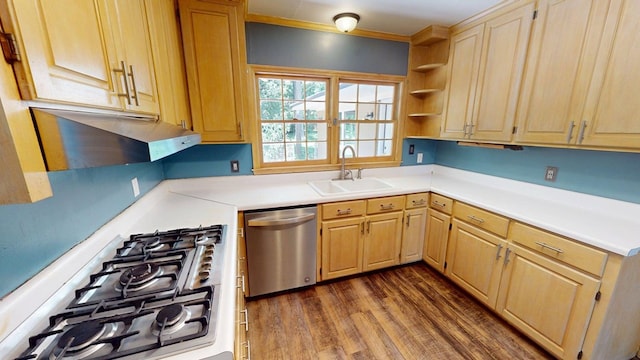 610 Partridge Dr, Thomasville, GA 31792 - kitchen with stainless steel appliances, a sink, dark wood finished floors, light countertops, and under cabinet range hood