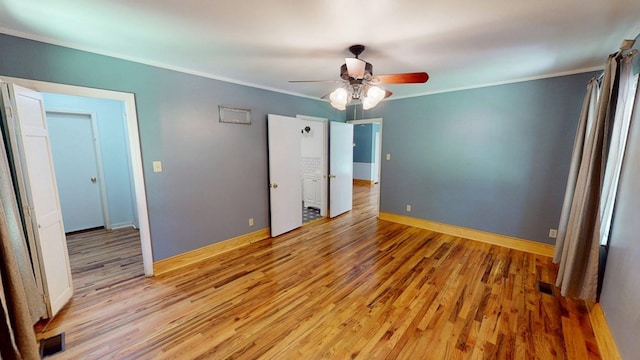 610 Partridge Dr, Thomasville, GA 31792 - unfurnished bedroom featuring light wood-style flooring, ornamental molding, ceiling fan, and baseboards