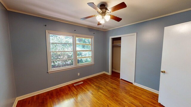 610 Partridge Dr, Thomasville, GA 31792 - unfurnished bedroom with hardwood / wood-style floors, baseboards, a closet, crown molding, and ceiling fan