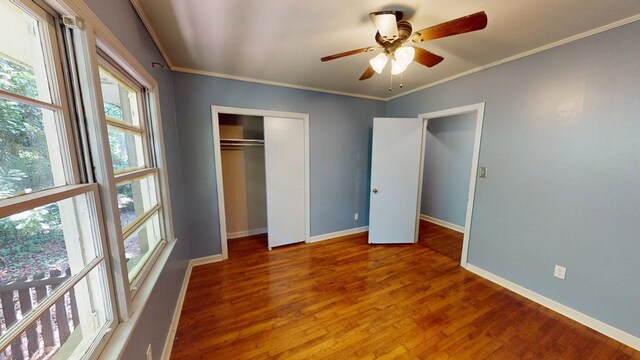 610 Partridge Dr, Thomasville, GA 31792 - unfurnished bedroom featuring crown molding, wood finished floors, baseboards, a closet, and a ceiling fan