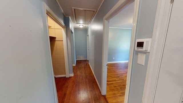 610 Partridge Dr, Thomasville, GA 31792 - hallway featuring attic access, hardwood / wood-style floors, ornamental molding, and baseboards