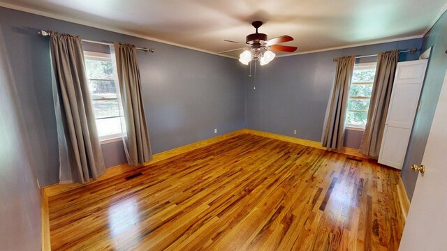 610 Partridge Dr, Thomasville, GA 31792 - spare room with wood finished floors, a ceiling fan, crown molding, and baseboards