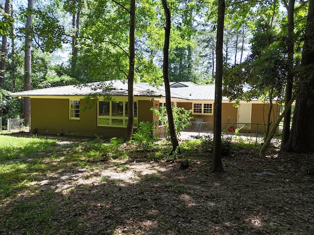 610 Partridge Dr, Thomasville, GA 31792 - back of house with fence and metal roof