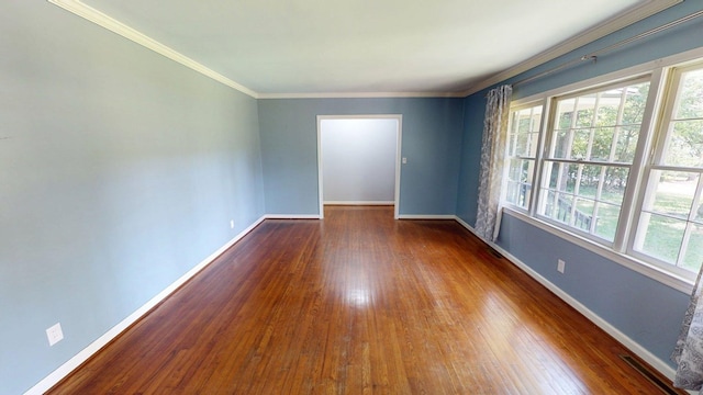 610 Partridge Dr, Thomasville, GA 31792 - unfurnished room with healthy amount of natural light, hardwood / wood-style floors, baseboards, and crown molding