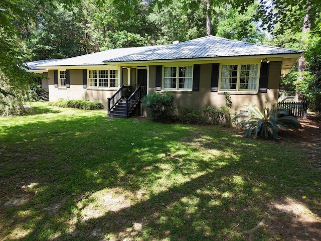 610 Partridge Dr, Thomasville, GA 31792 - ranch-style house featuring a front lawn and metal roof