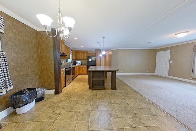 3024 Willow St, Ochlocknee, GA 31773 - kitchen featuring appliances with stainless steel finishes, a chandelier, brown cabinetry, crown molding, and decorative light fixtures