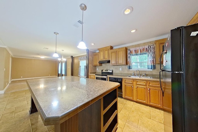 3024 Willow St, Ochlocknee, GA 31773 - kitchen featuring black appliances, ornamental molding, a center island, hanging light fixtures, and recessed lighting
