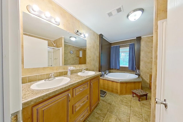 3024 Willow St, Ochlocknee, GA 31773 - full bath featuring a garden tub, a stall shower, double vanity, tile patterned flooring, and crown molding