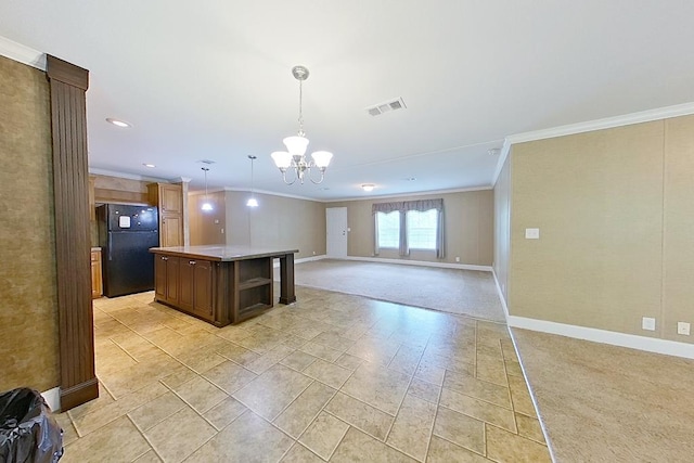 3024 Willow St, Ochlocknee, GA 31773 - kitchen with freestanding refrigerator, ornamental molding, a chandelier, open floor plan, and a kitchen island