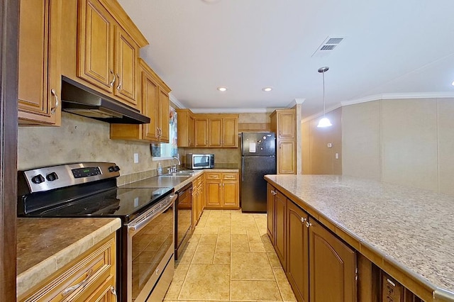 3024 Willow St, Ochlocknee, GA 31773 - kitchen with appliances with stainless steel finishes, under cabinet range hood, crown molding, backsplash, and brown cabinetry