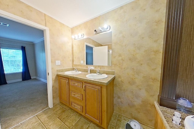 3024 Willow St, Ochlocknee, GA 31773 - full bath with double vanity, tile patterned floors, and ornamental molding