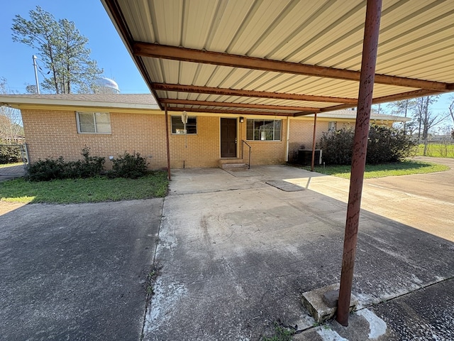 view of patio with an attached carport and central AC