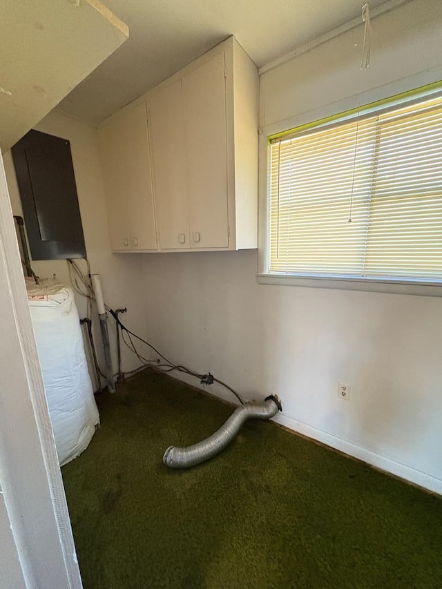 laundry area with baseboards and cabinet space
