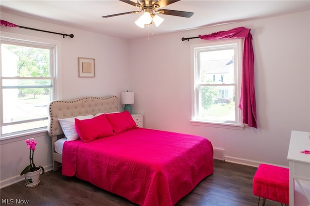 bedroom featuring ceiling fan and dark wood-type flooring