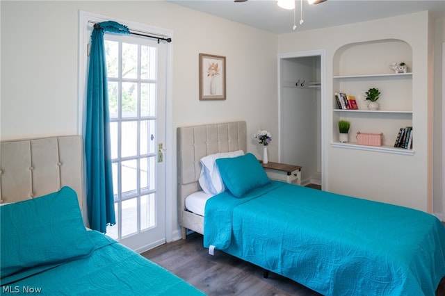 bedroom with a closet, ceiling fan, and dark hardwood / wood-style floors