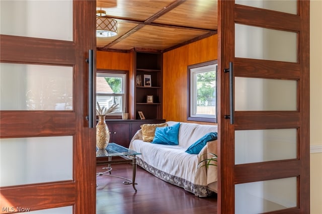 interior space featuring wooden walls, wood-type flooring, and wooden ceiling