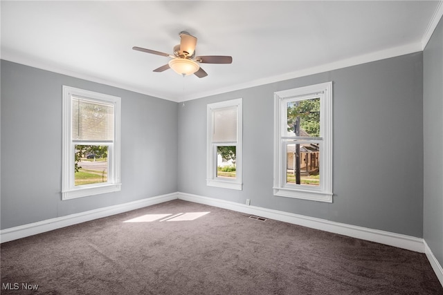 unfurnished room with carpet flooring, ceiling fan, and ornamental molding