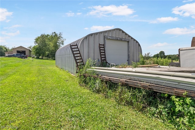 view of outdoor structure featuring a yard