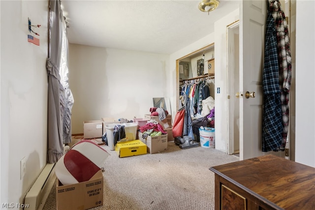 bedroom with carpet and a closet