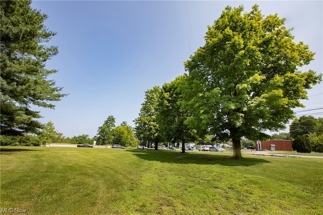 view of home's community featuring a lawn