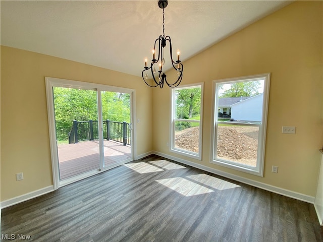 unfurnished dining area with dark wood-style floors, lofted ceiling, baseboards, and an inviting chandelier