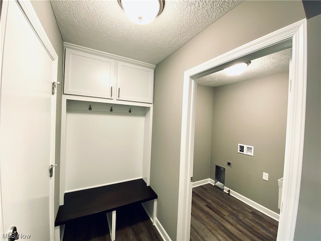 mudroom featuring a textured ceiling and dark hardwood / wood-style floors