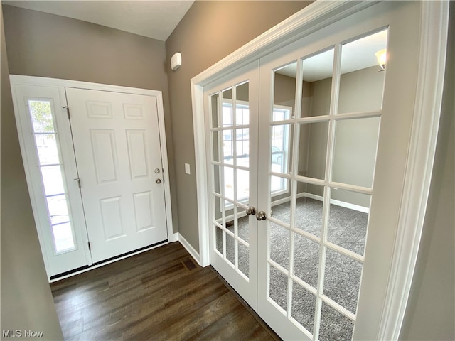 foyer entrance featuring dark wood-type flooring and french doors