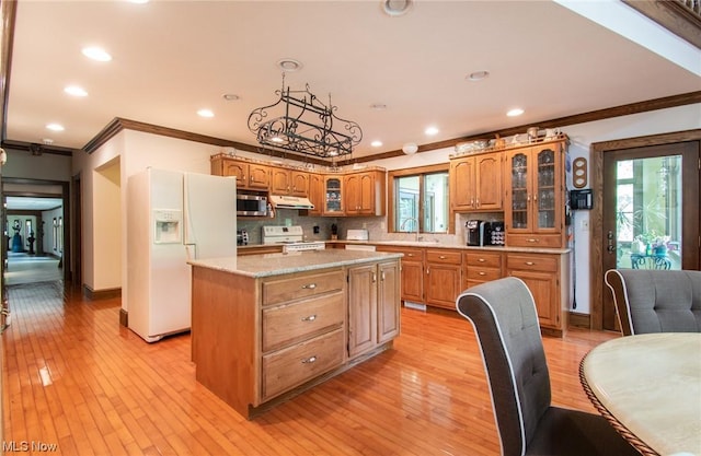 347 State Route 14, Columbiana, OH 44408 - kitchen with sink, white appliances, a kitchen island, and decorative backsplash