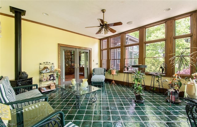 interior space with ceiling fan and french doors