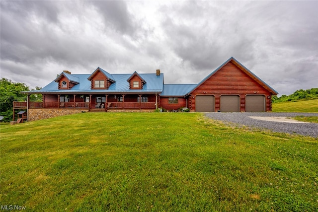 log-style house featuring a garage, a front yard, and a porch