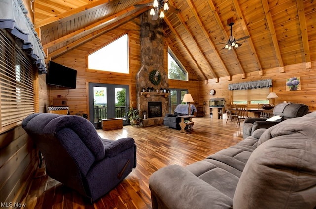 living room featuring wood ceiling, ceiling fan, wood walls, and hardwood / wood-style floors