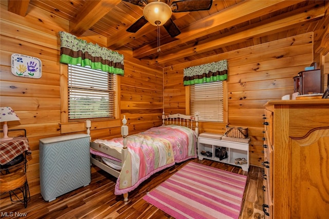 bedroom featuring wood ceiling, beamed ceiling, ceiling fan, and dark hardwood / wood-style floors