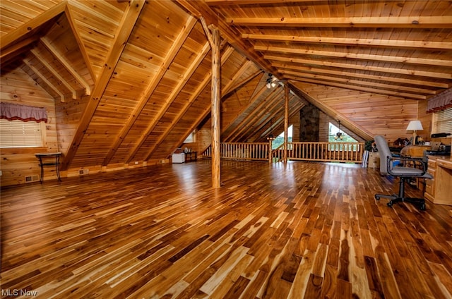 interior space with hardwood / wood-style floors, lofted ceiling with beams, and wooden ceiling