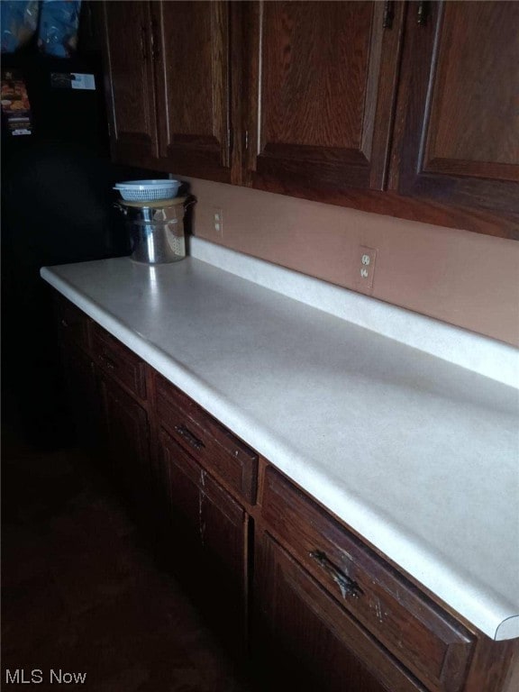 kitchen with dark brown cabinets