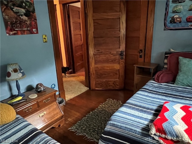 bedroom with wood-type flooring