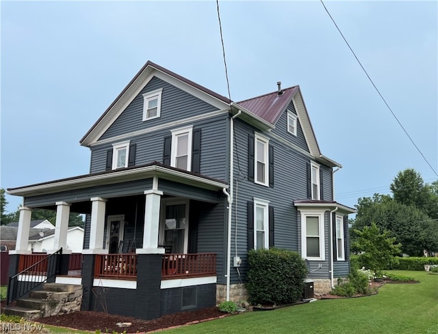 view of front of house with a front lawn and a porch